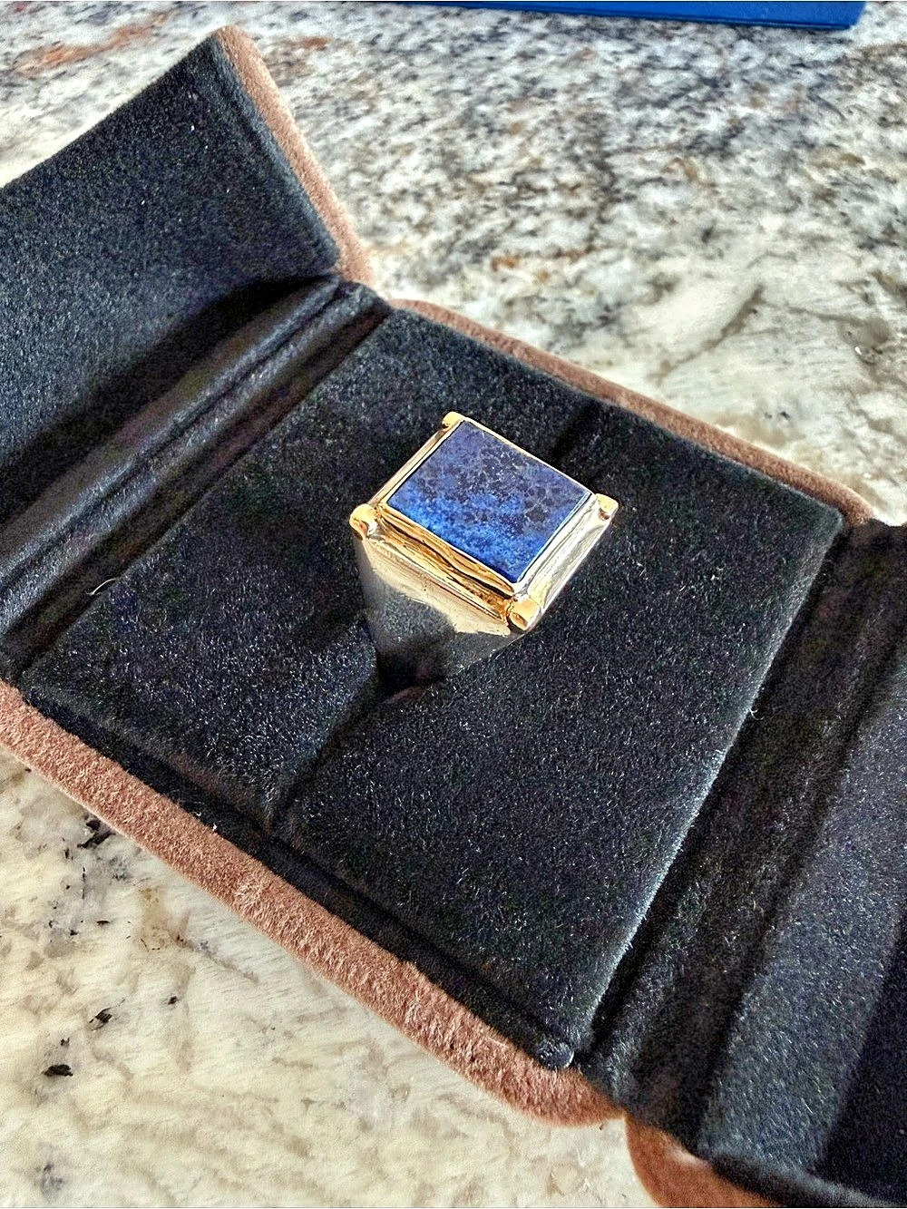 Blue Lapis Stone Ring With 18k Gold Surrounding The Stone On A Sterling Silver R